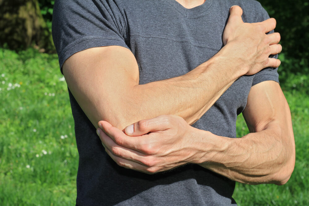 what does arthritis in the elbow feel like?
