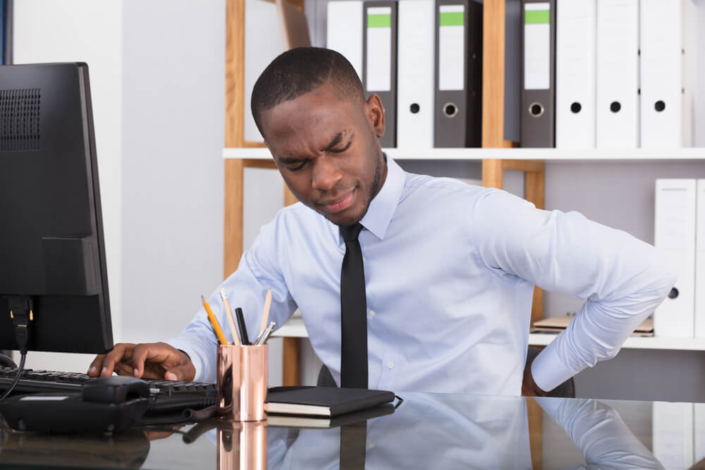 Why do I experience pain when sitting?