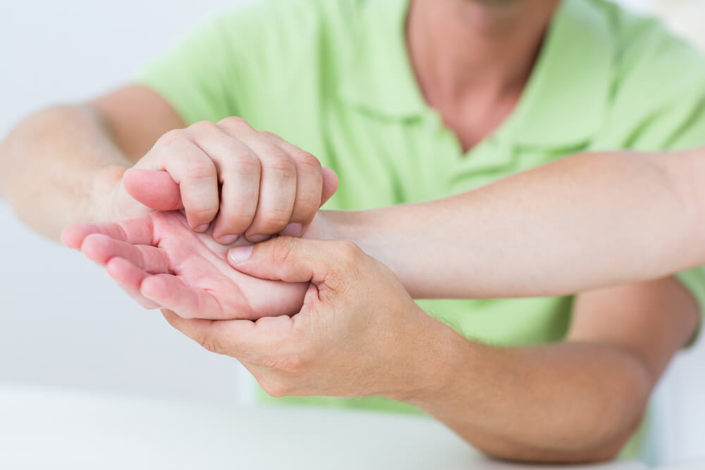 What will a physical therapist do during a thumb arthritis test?