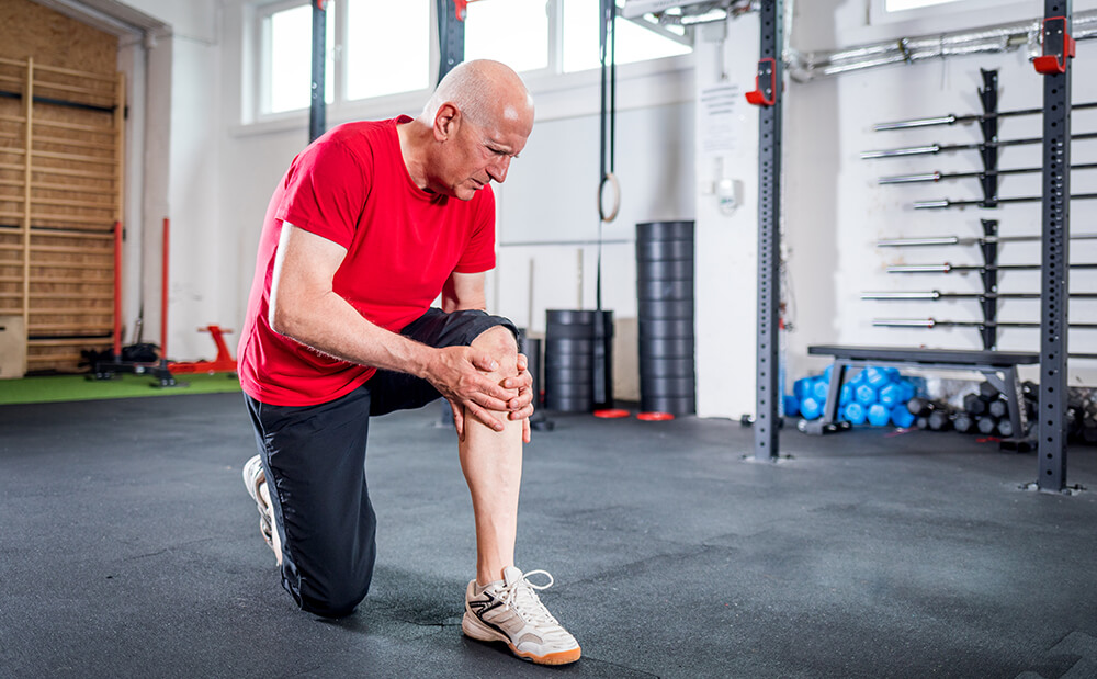 Lower leg pain after knee replacement? Here's why and how to manage it senior man at the gym suffering from pain in knee 2021 08 30 00 36 09 utc 1 lower leg pain after knee replacement? here's why and how to manage it continuum