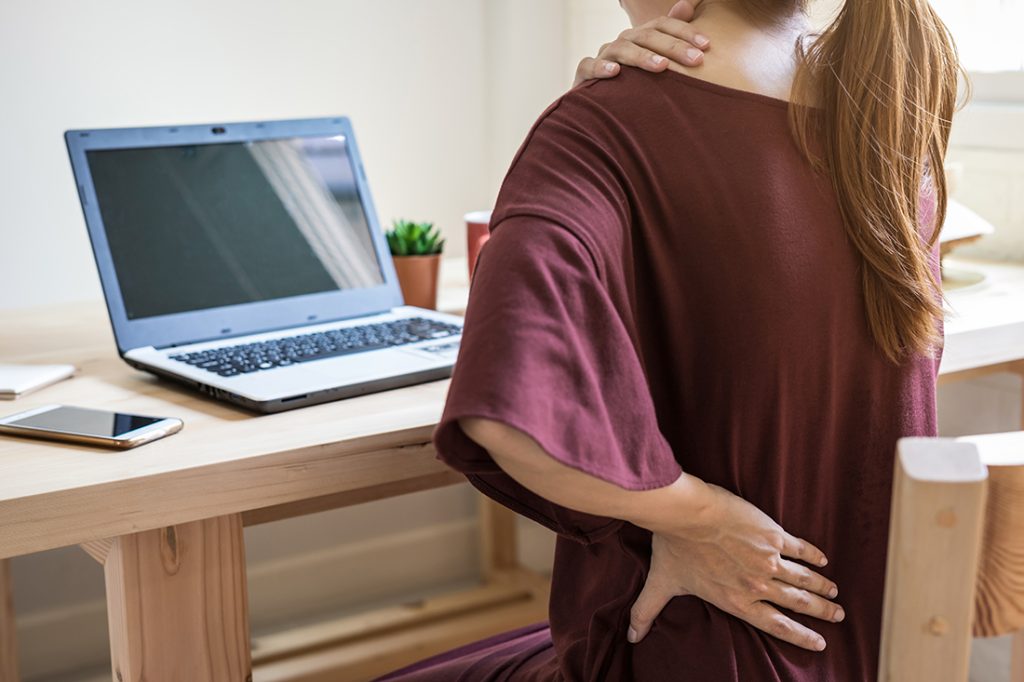 Burning sensation in your lower back and abdomen: Here are some possible explanations young woman working at home and having back pain 2021 10 06 09 51 49 utc burning sensation in your lower back and abdomen: here are some possible explanations back pain