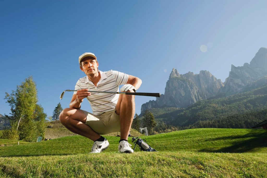 4 treatments & 3 tips for golf-related knee pain italy kastelruth mid adult man on golf course 2022 12 16 22 24 27 utc scaled 1 mid adult man squatting on golf course